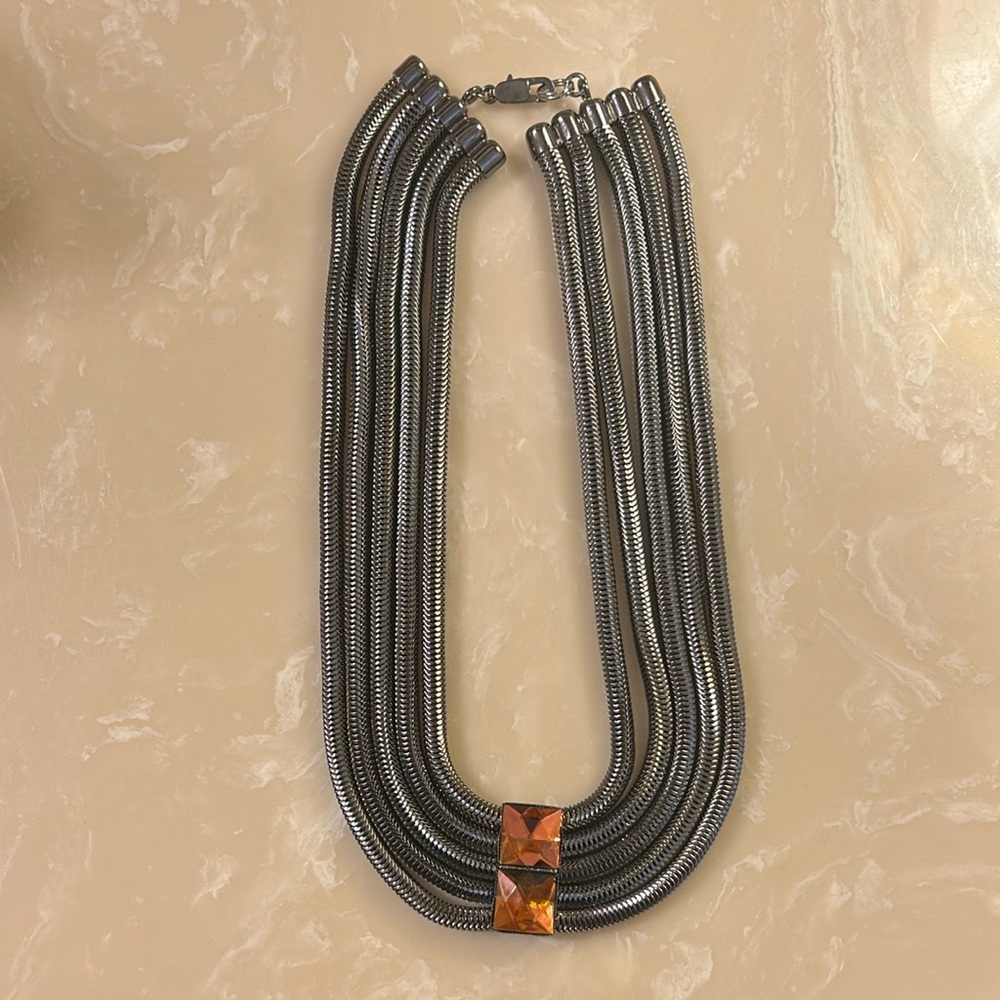 Unique gunmetal silver  multi strand necklace with multi colored stones.